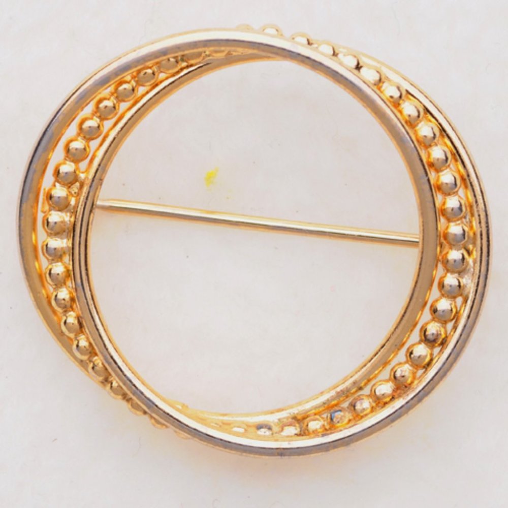 Gold plated on silver twisted circle brooch